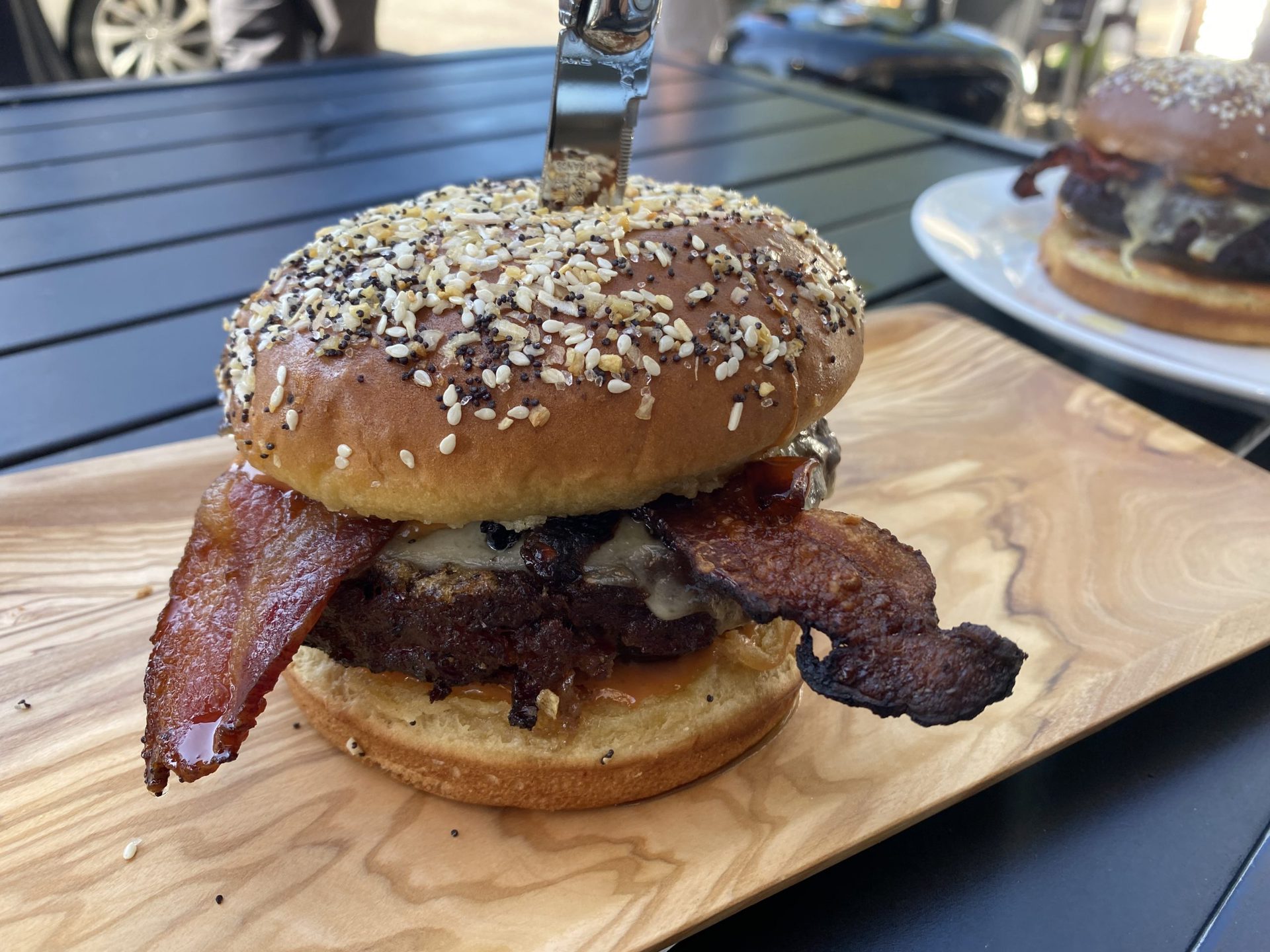 Burger on a wood board.