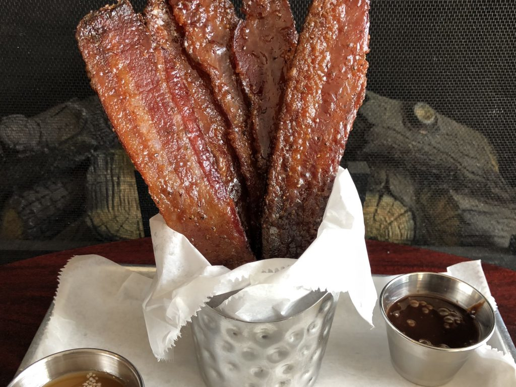 Strips of bacon in a basket.