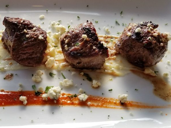 Filet medallions on a plate.