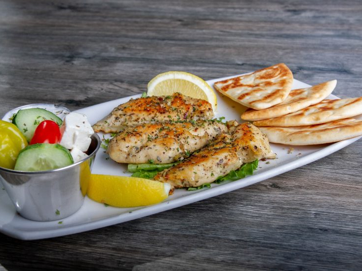 Chicken and sides on a plate.