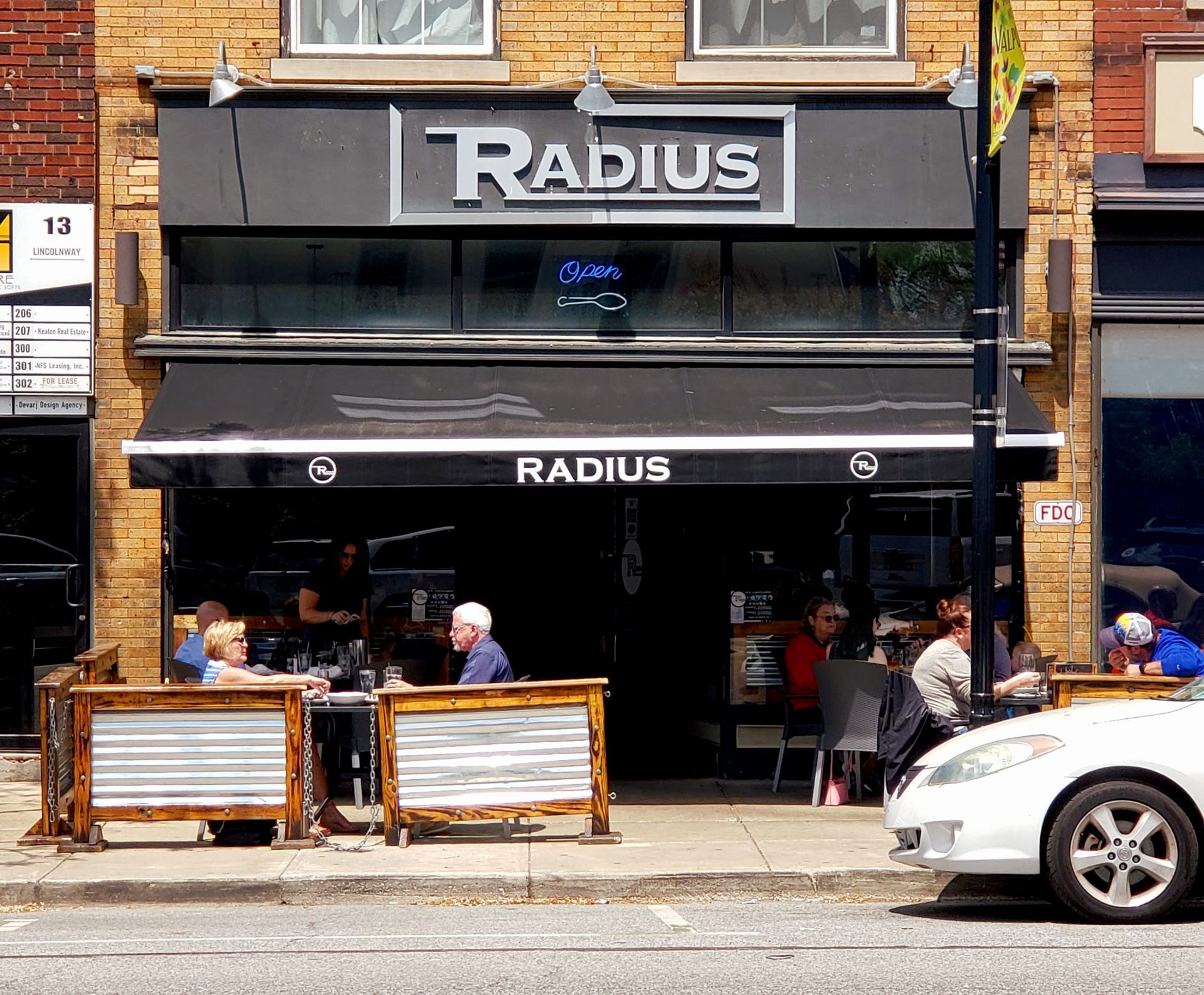 People enjoying food in outdoor seating.